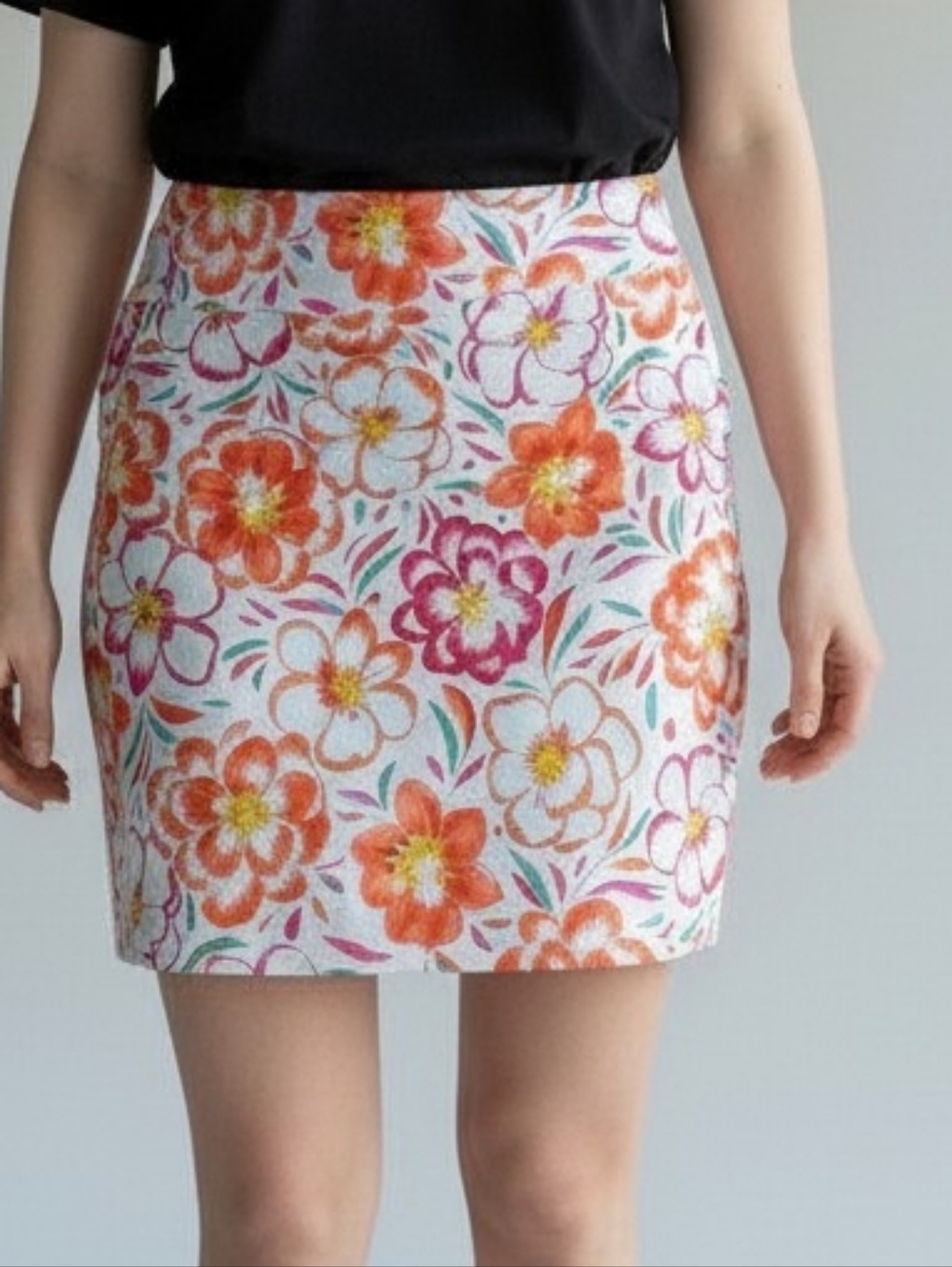 Greg Norman Floral A-Line Mini Skort in White with Orange & Pink Blooms 4